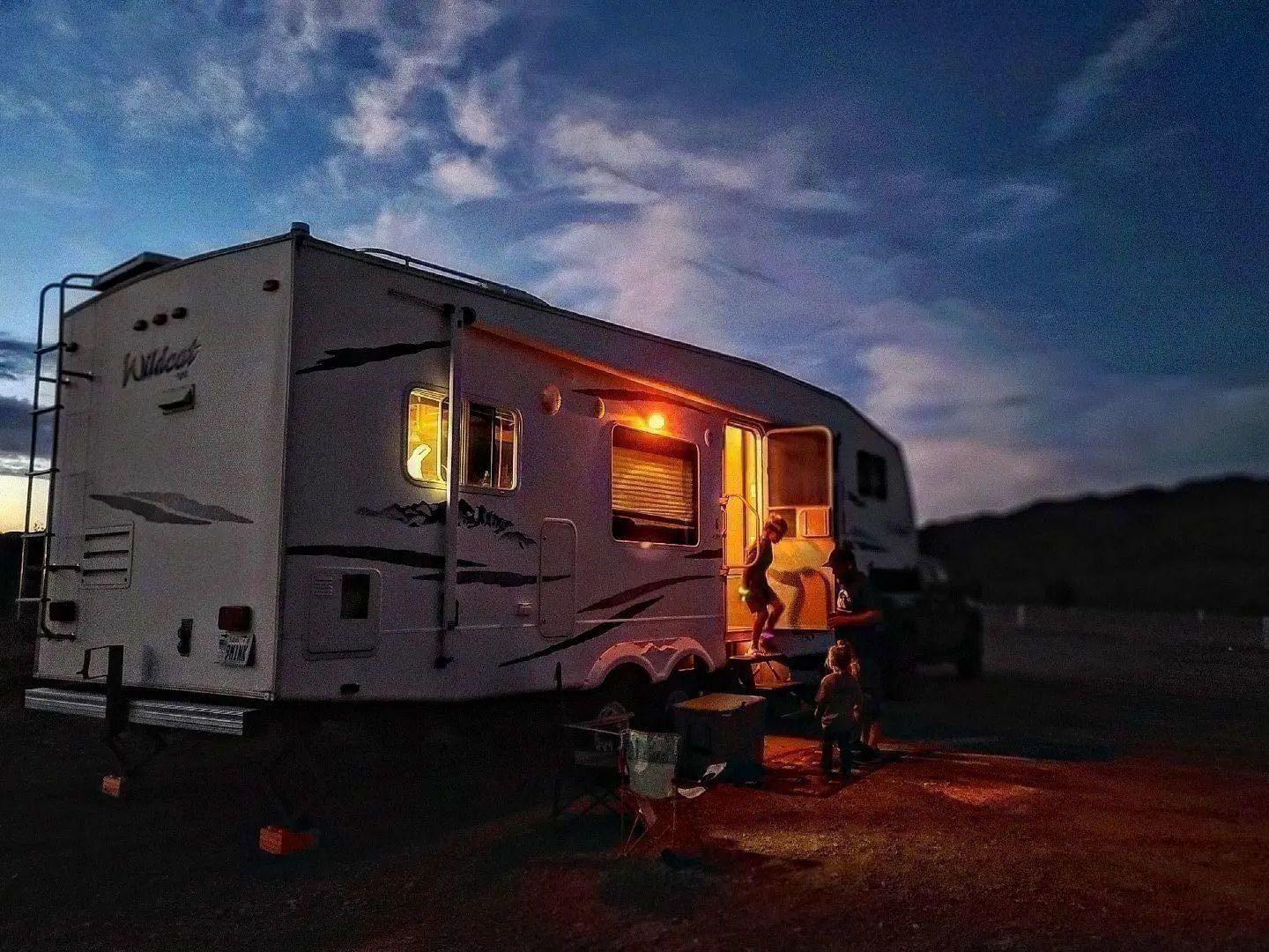 Family at RV in evening