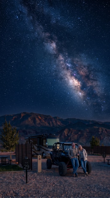 Milky Way over the park with a side-by-side parked at camp